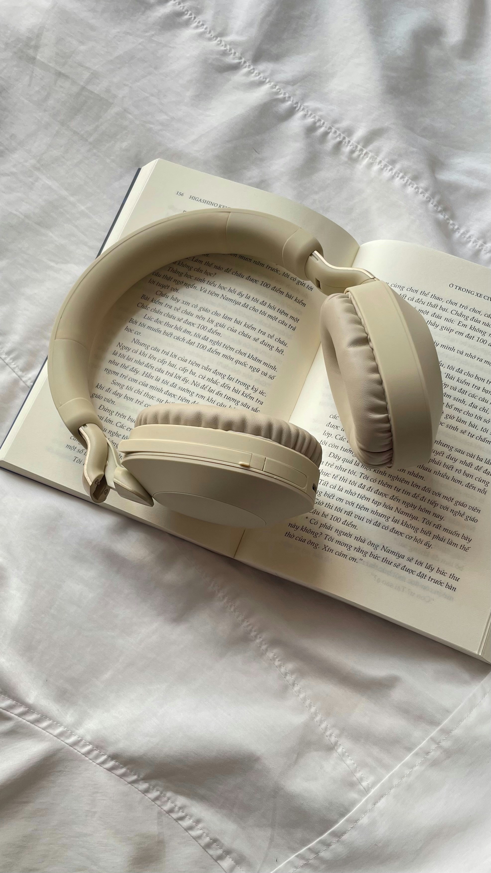 book with headphones on top